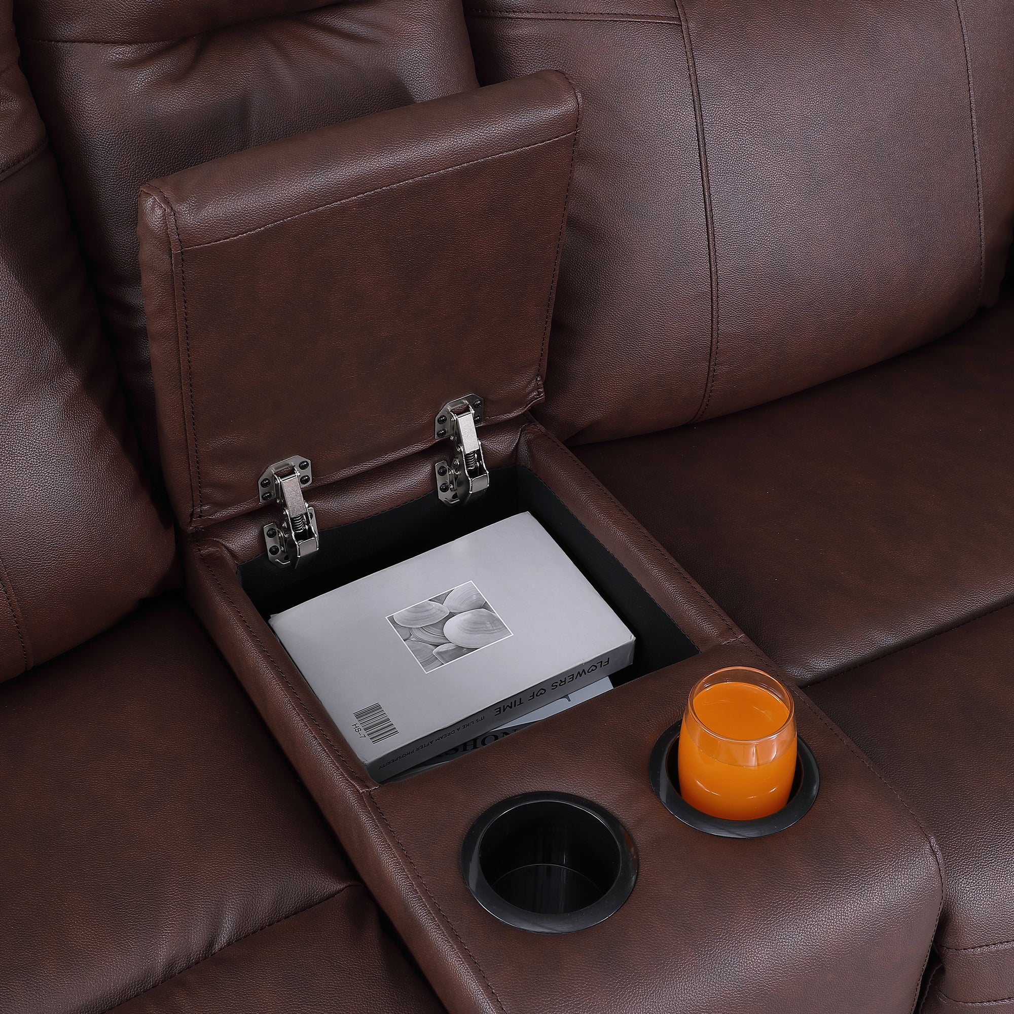 the flip-top storage compartment and two cup holders