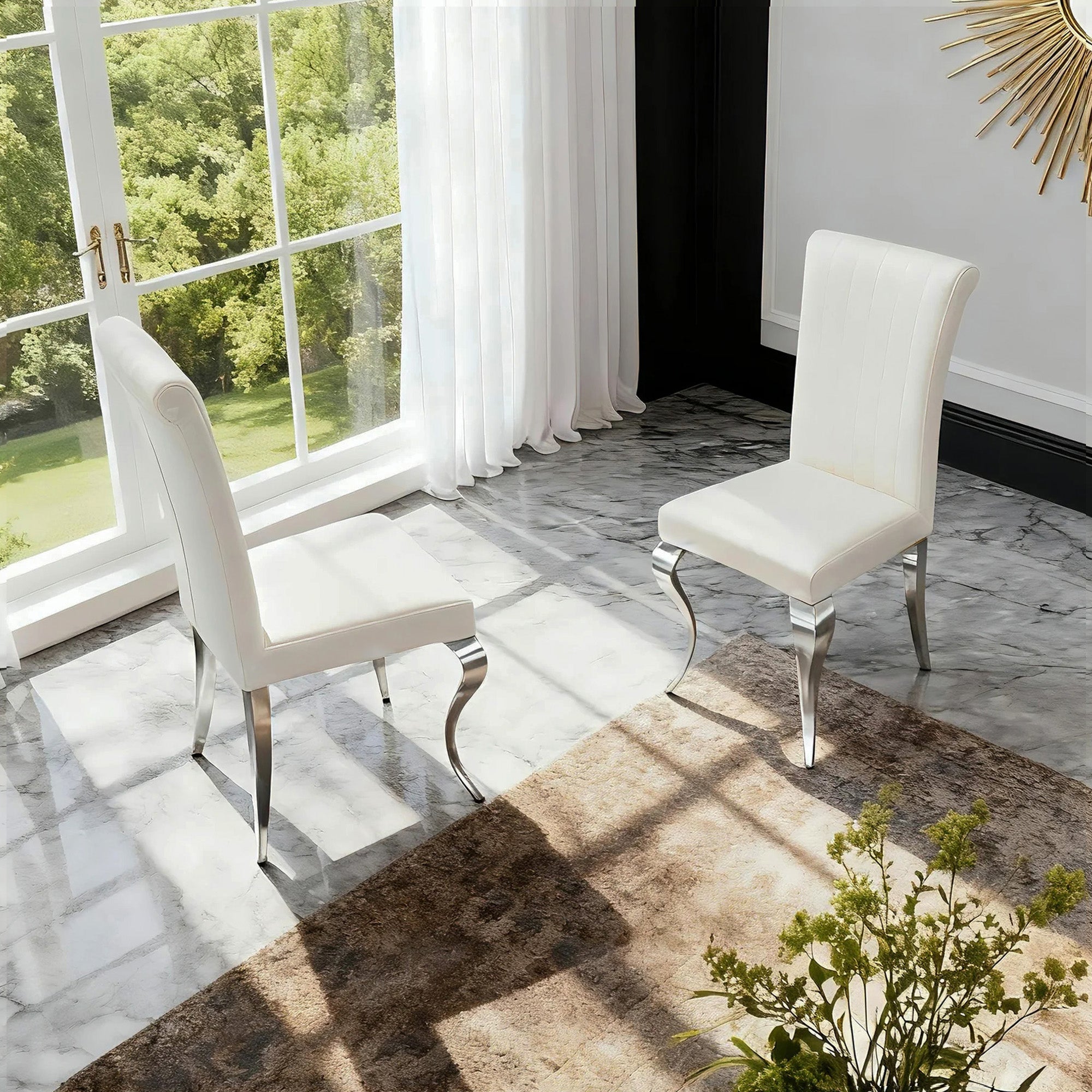 White Fabric Modern Sliver Dining Chair is placed in the dining room,being both beautiful and practical.