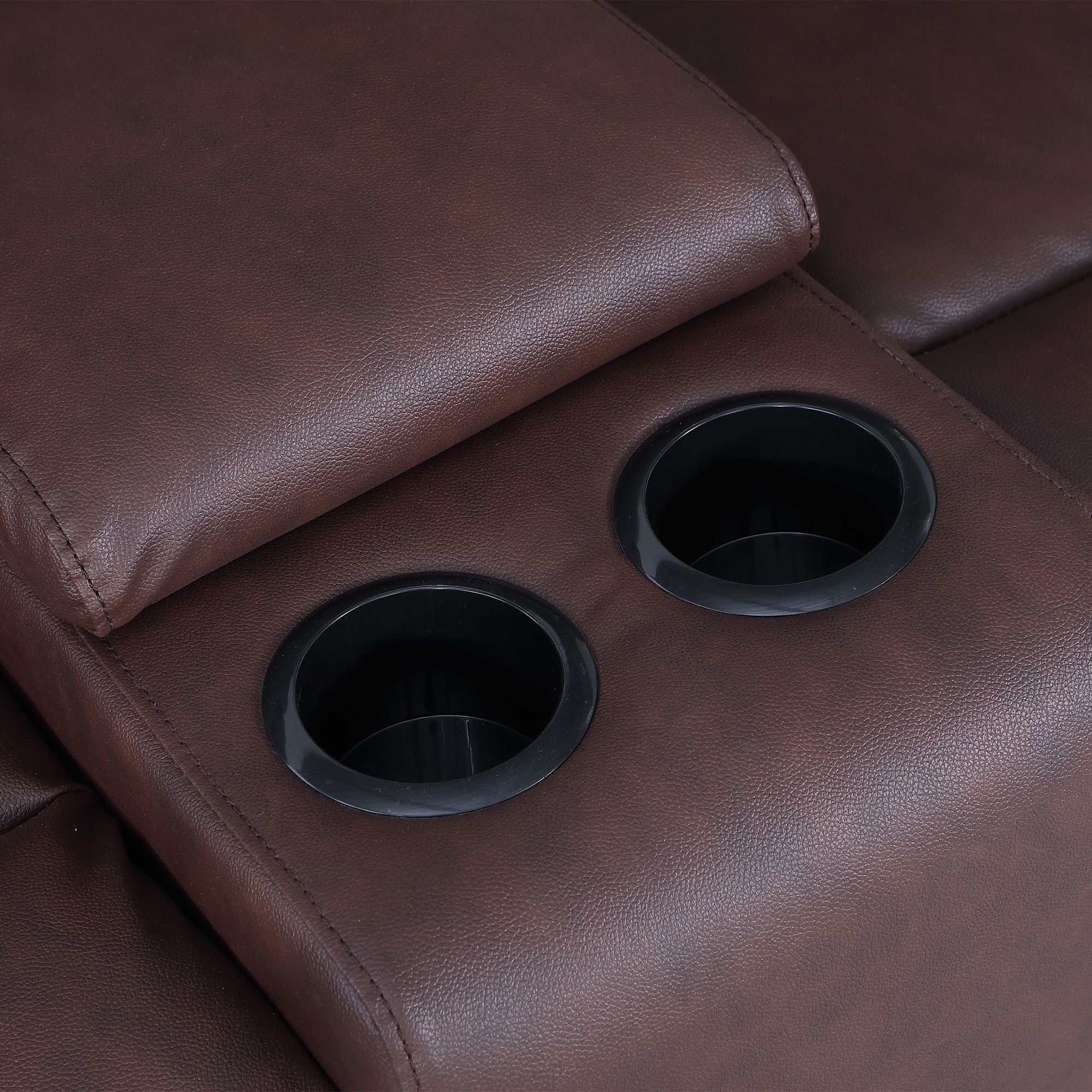The two cup holders of the loveseat