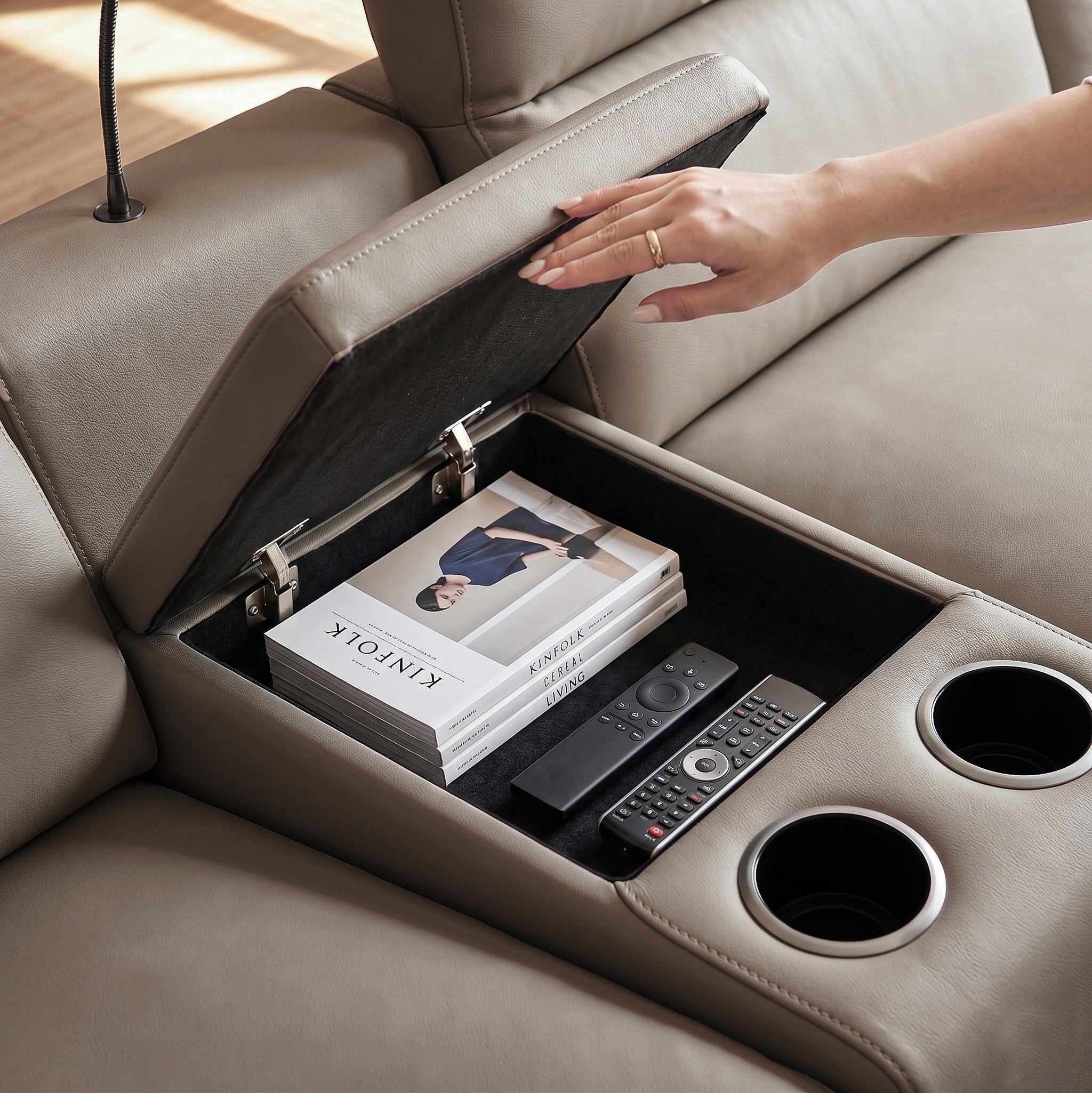 Flip-top armrests reveal a spacious hidden compartment, perfect for tucking away remote controls, tablet devices, or books, keeping your lounging area clutter-free.