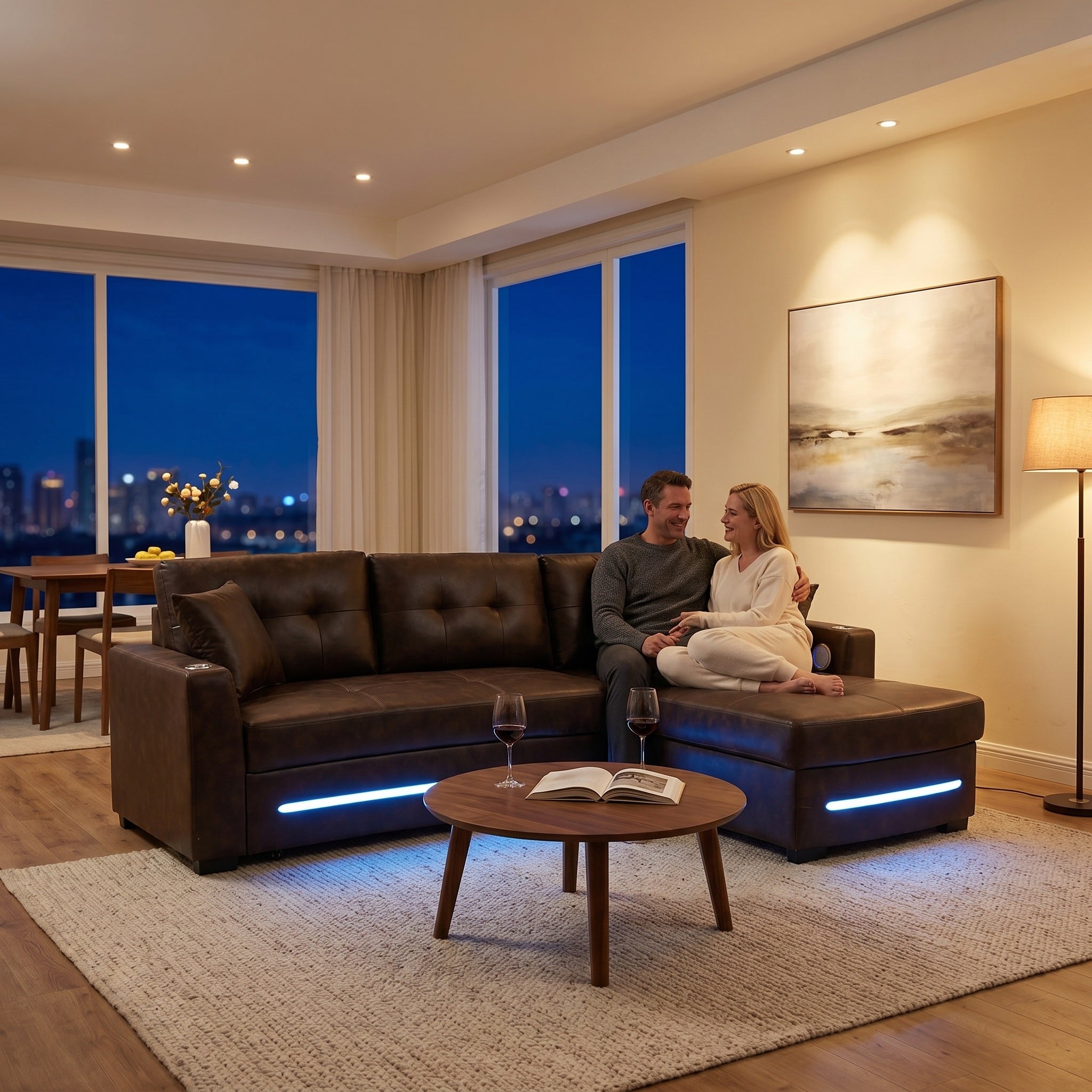 Brown L-shaped sectional sofa bed with LED strip lighting,bluetooth speaker, wireless charging and cup holders.A couple was sitting it, drinking and chatting, creating a very cozy atmosphere.