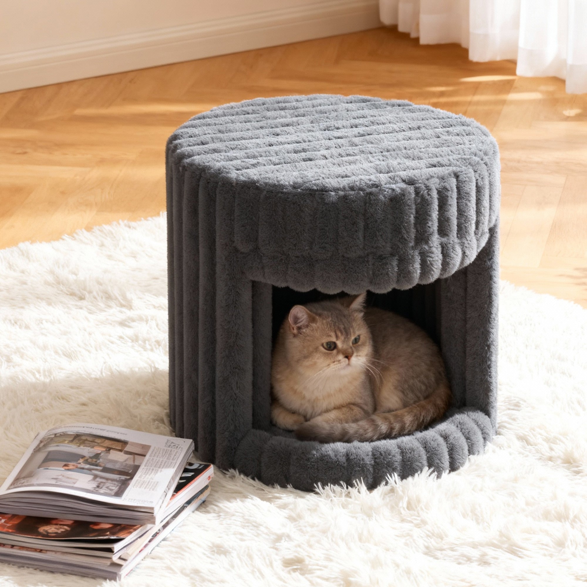 In the VANITII Grey Rabbit Hair Cat Bed, there is a little cat lying inside.It is placed in the bedroom,being both beautiful and practical.