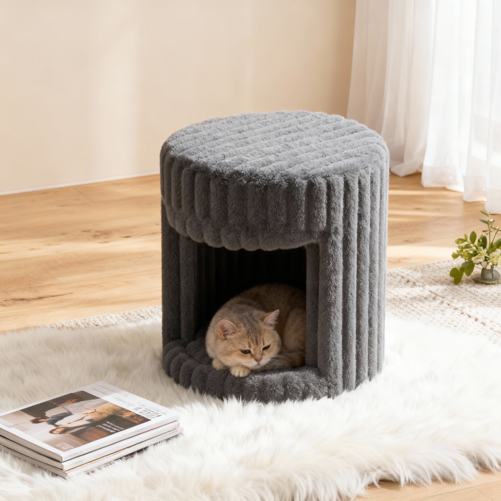 In the VANITII Grey Rabbit Hair Cat Bed, there is a little cat lying inside.It is placed in the bedroom,being both beautiful and practical.